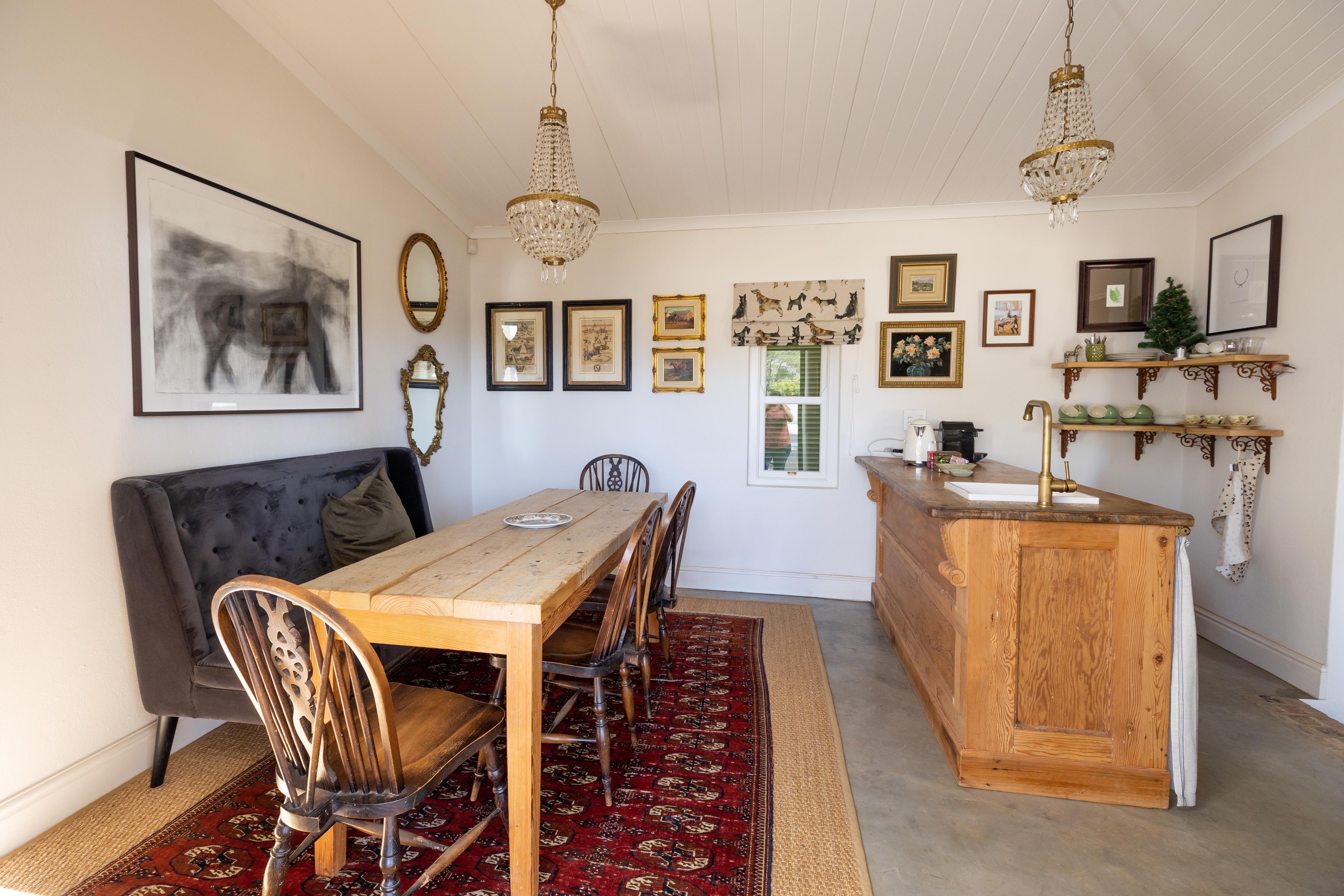 Elegant tea room with dining area and equestrian artwork