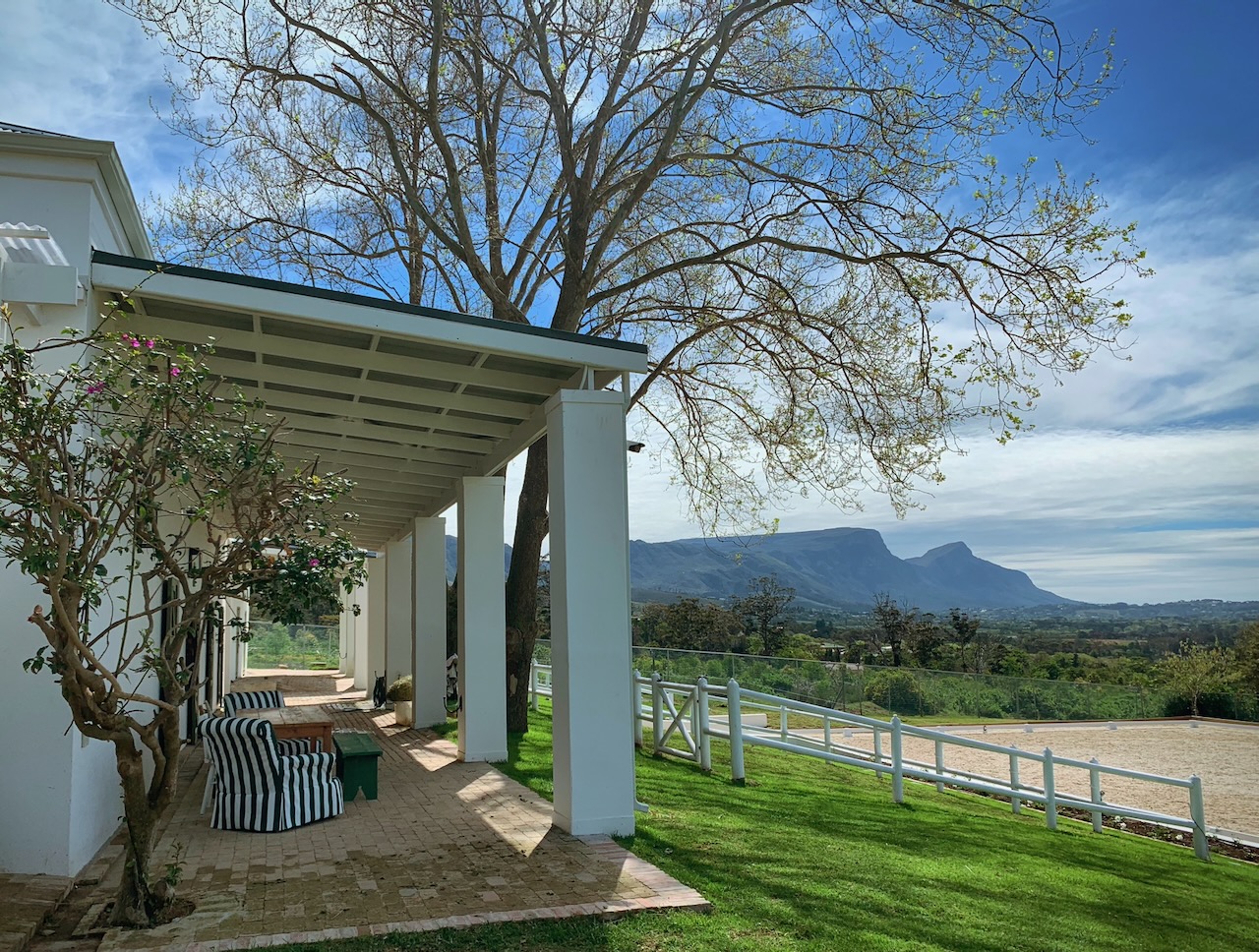 Covered veranda with mountain views and outdoor seating area